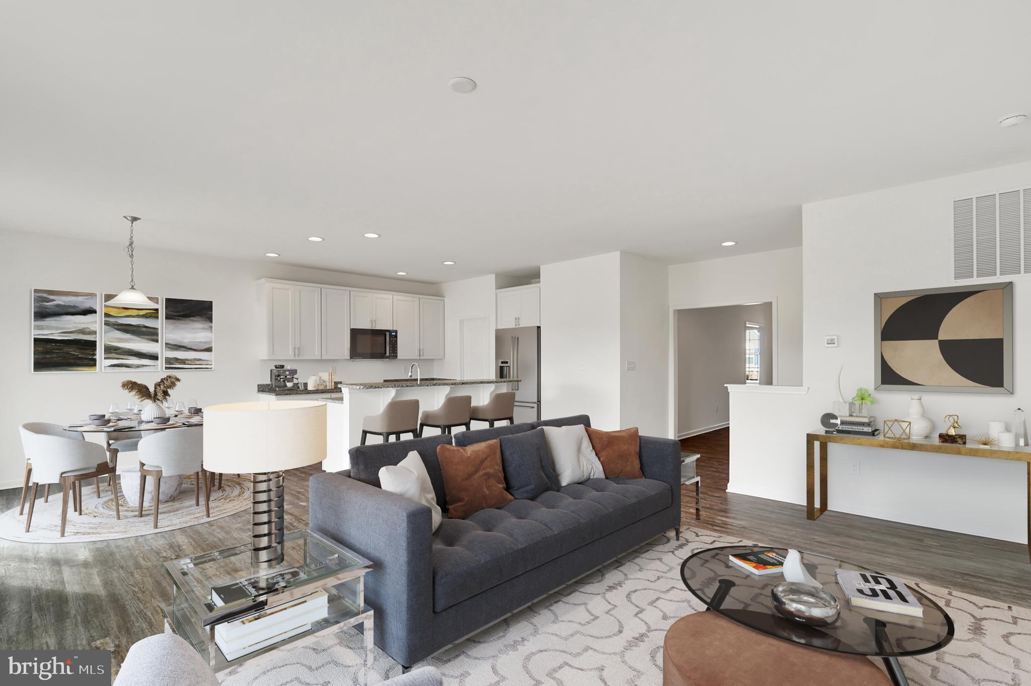 113 Lacantera Lane Felton, DE 19943 - Photo 4 of 6 a living room with furniture kitchen view and a chandelier