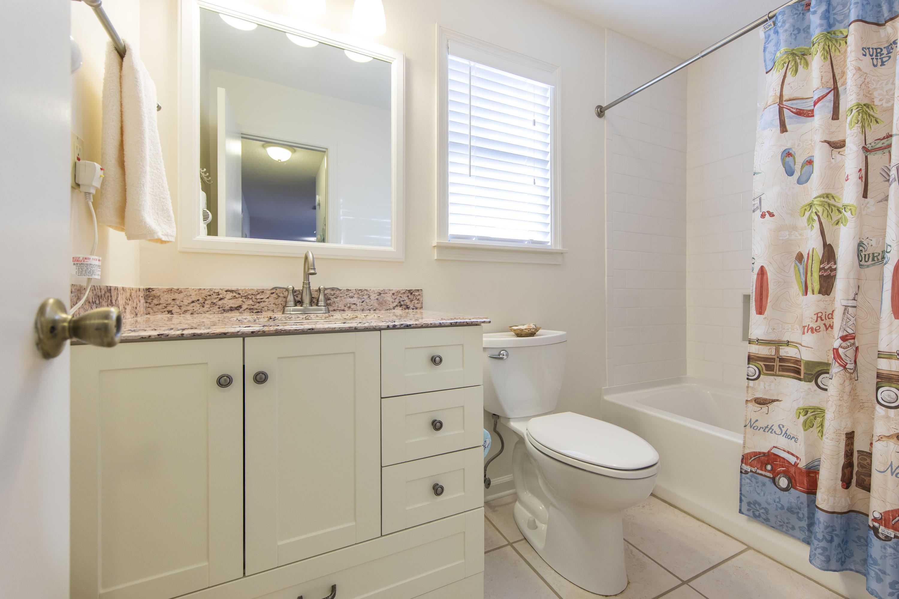 3799 Cty Highway, Unit H10 Santa Rosa Beach, FL 32459 - Photo 20 of 21 a bathroom with a granite countertop toilet sink and mirror