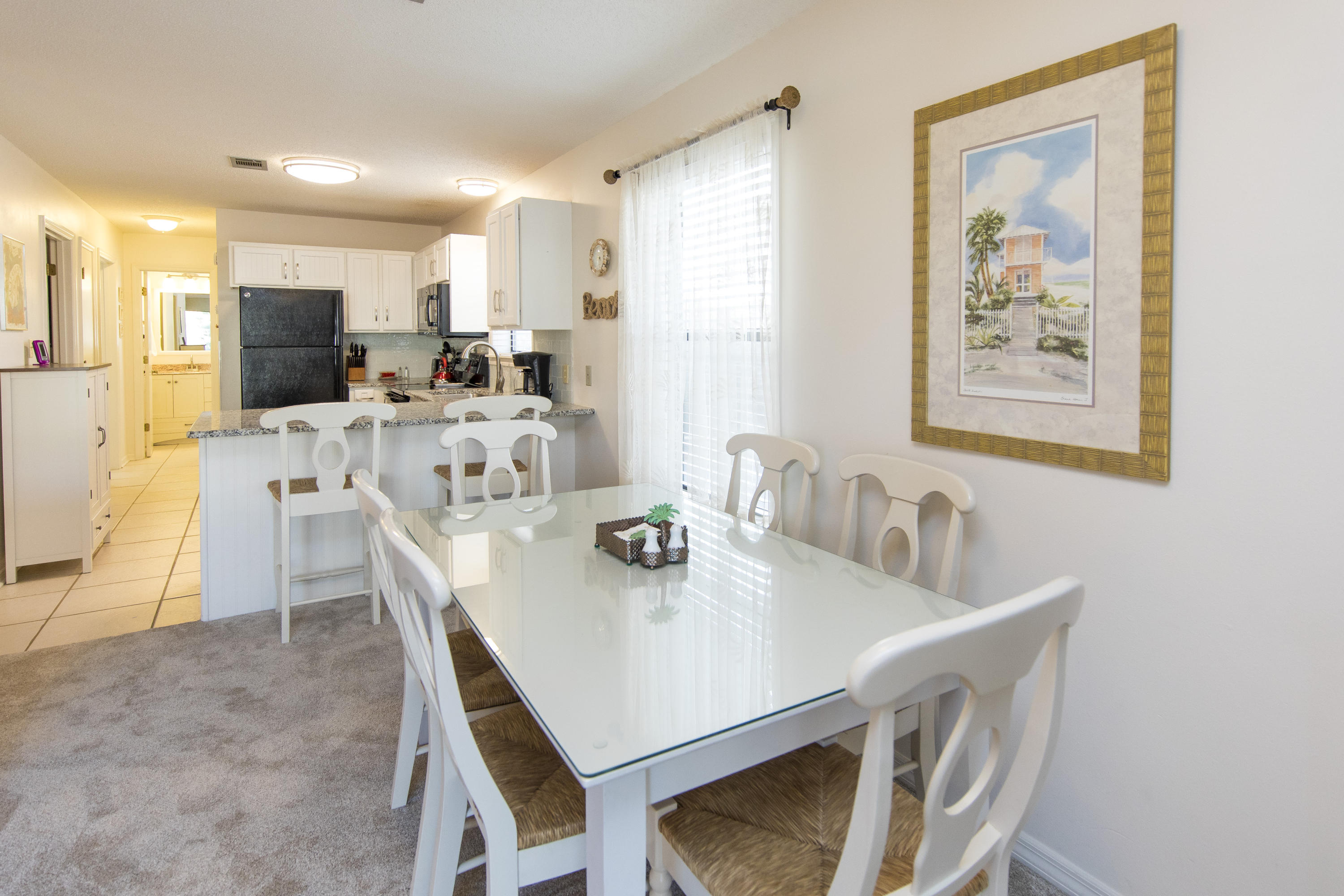 3799 Cty Highway, Unit H10 Santa Rosa Beach, FL 32459 - Photo 7 of 21 a view of a dining room with furniture and a kitchen