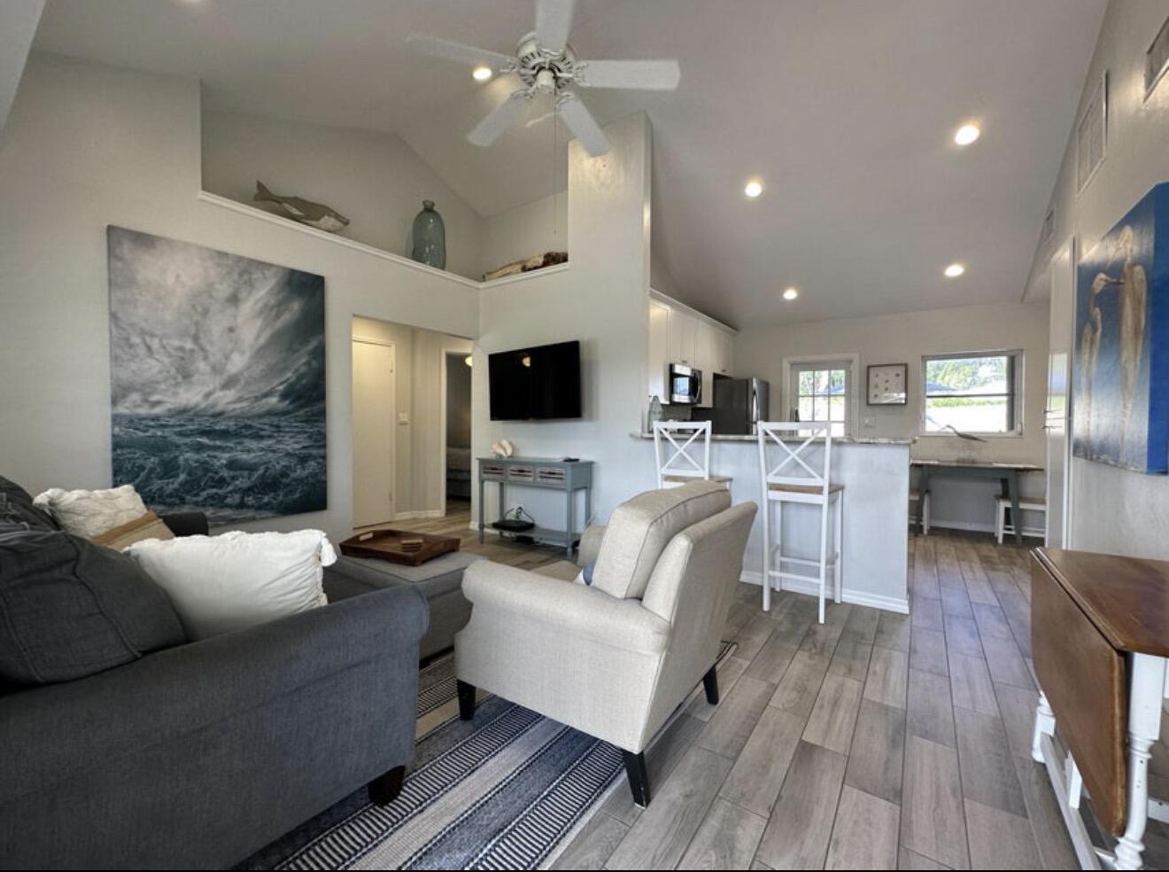 49 Douglas Drive Ocean Ridge, FL 33435 - Photo 11 of 65 a living room with furniture and a flat screen tv