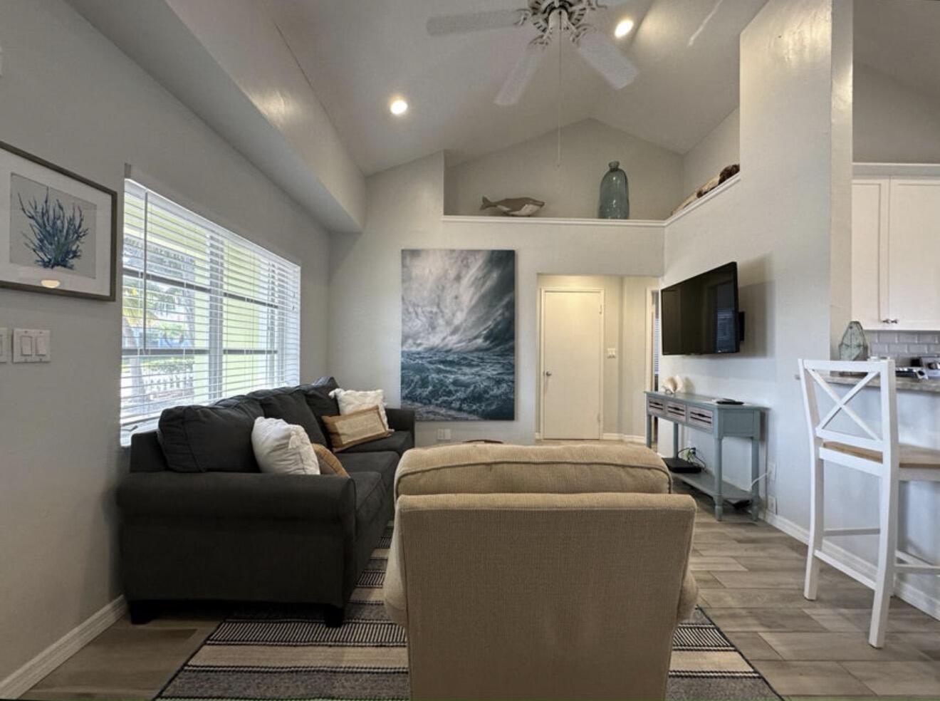 49 Douglas Drive Ocean Ridge, FL 33435 - Photo 13 of 65 a living room with furniture and a flat screen tv