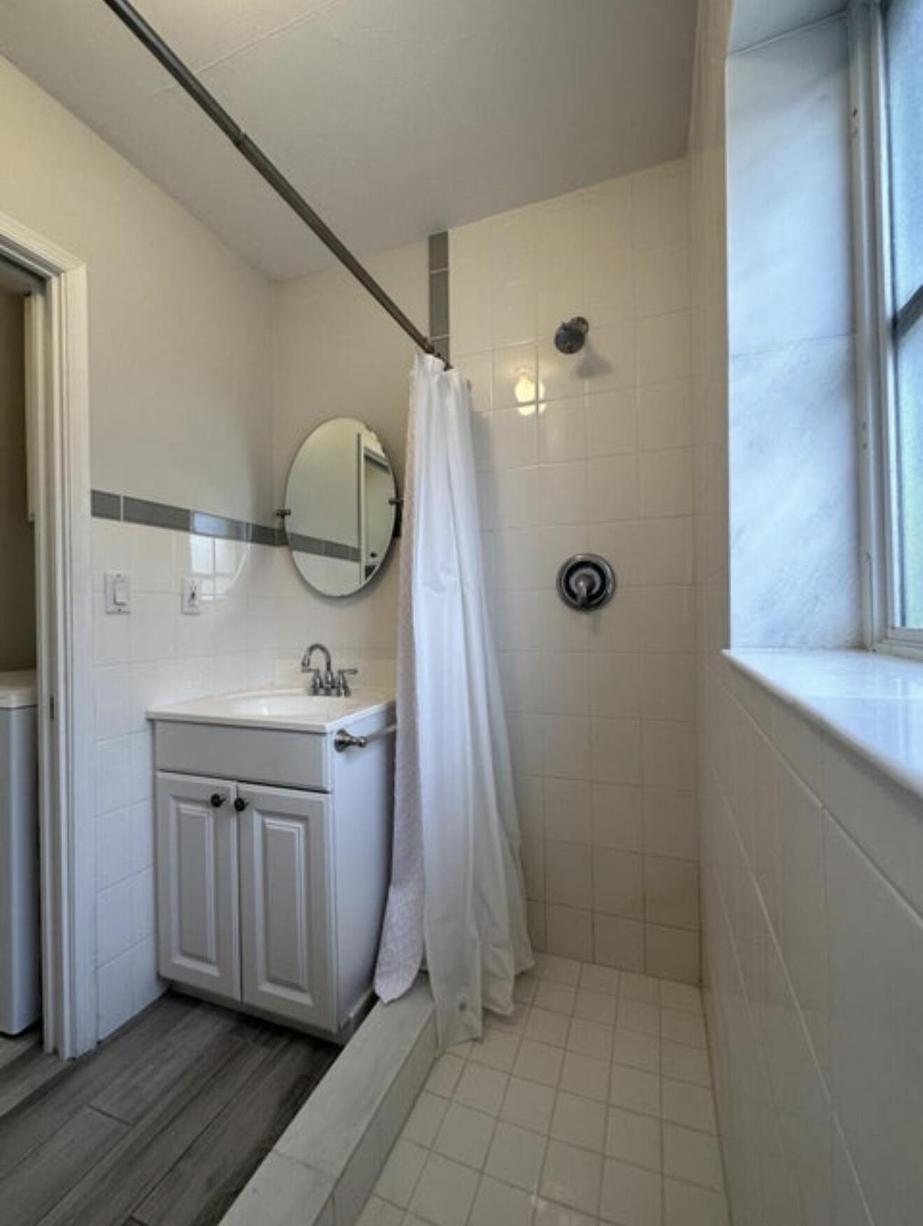 49 Douglas Drive Ocean Ridge, FL 33435 - Photo 25 of 65 a bathroom with a sink a toilet and shower