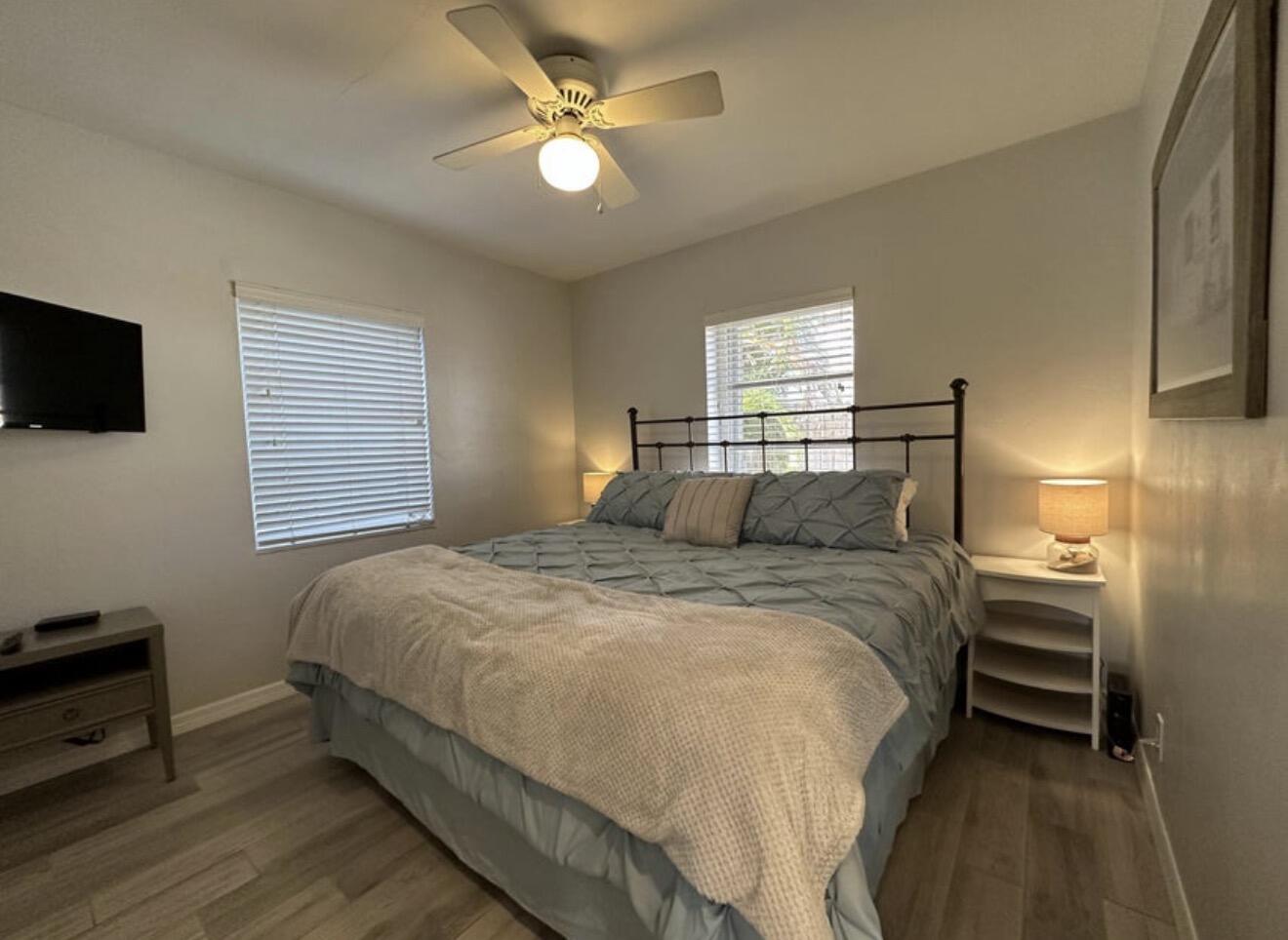 49 Douglas Drive Ocean Ridge, FL 33435 - Photo 36 of 65 a bedroom with a bed and a tv