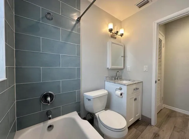 a view of balcony with wooden floor and outdoor seating