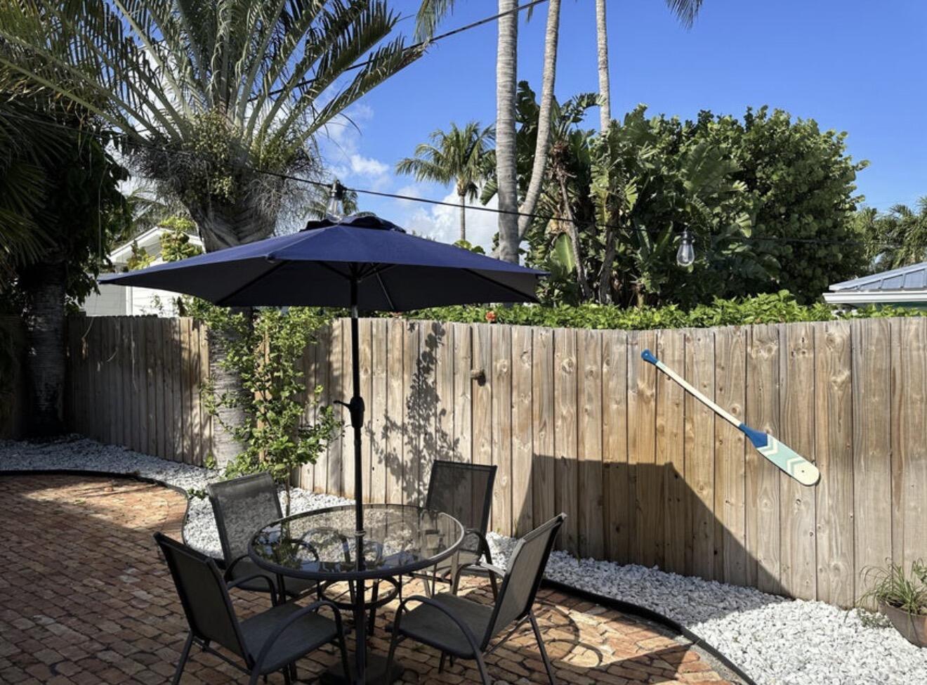 49 Douglas Drive Ocean Ridge, FL 33435 - Photo 48 of 65 a view of balcony with wooden floor and outdoor seating