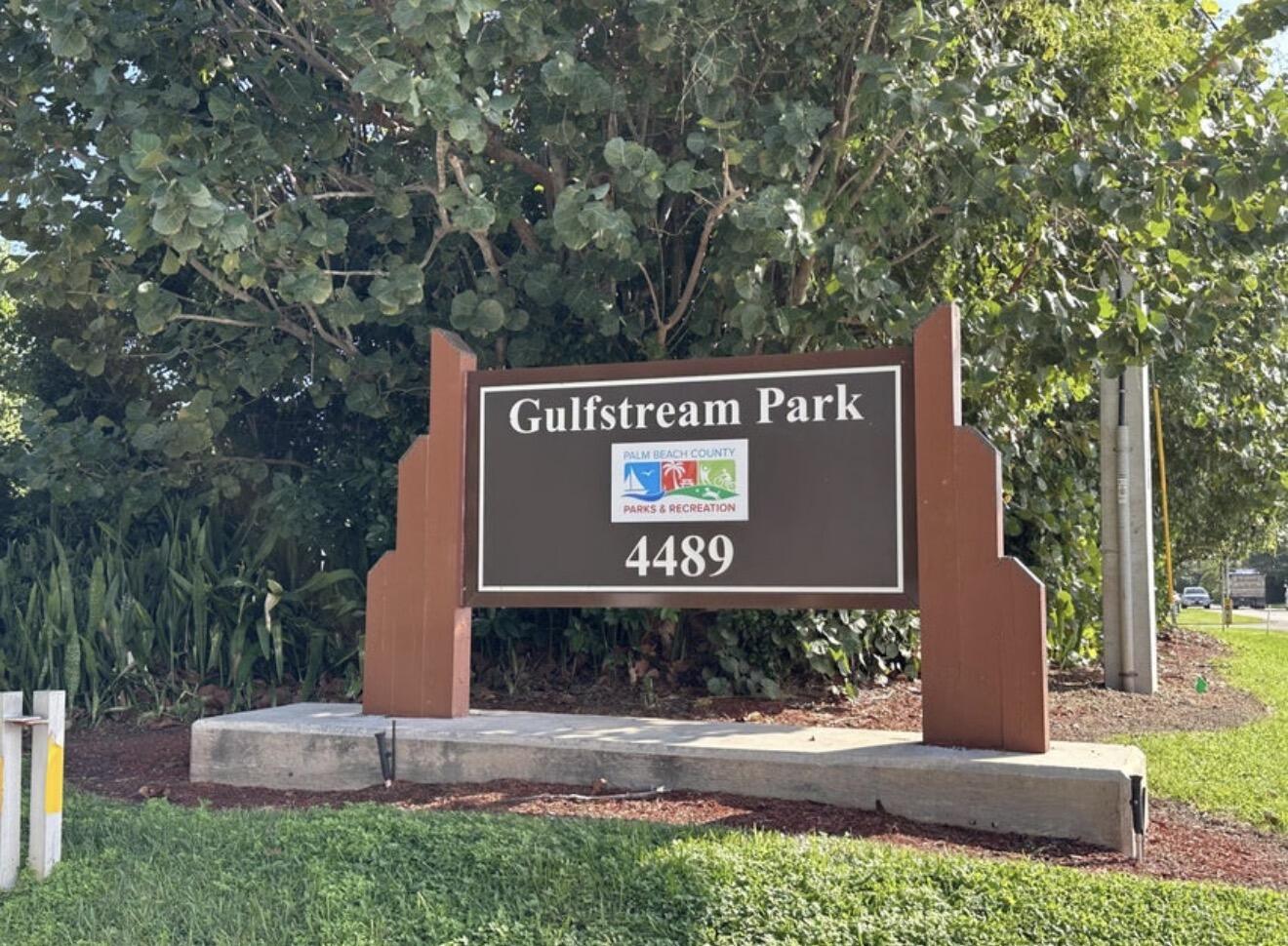 49 Douglas Drive Ocean Ridge, FL 33435 - Photo 65 of 65 a sign that is on the side of a building