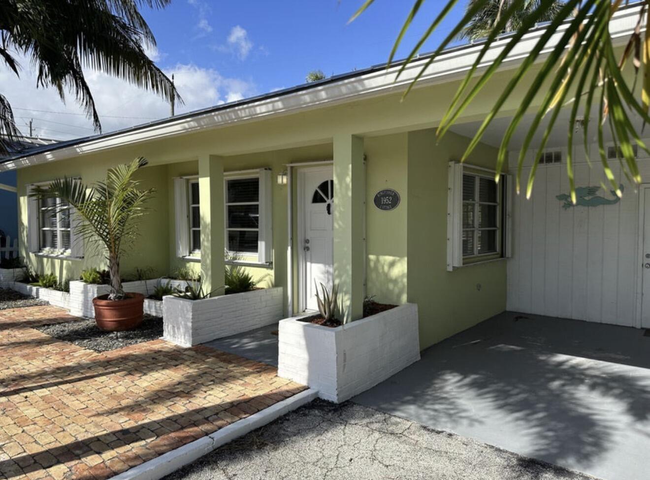 49 Douglas Drive Ocean Ridge, FL 33435 - Photo 7 of 65 a view of a house with a patio