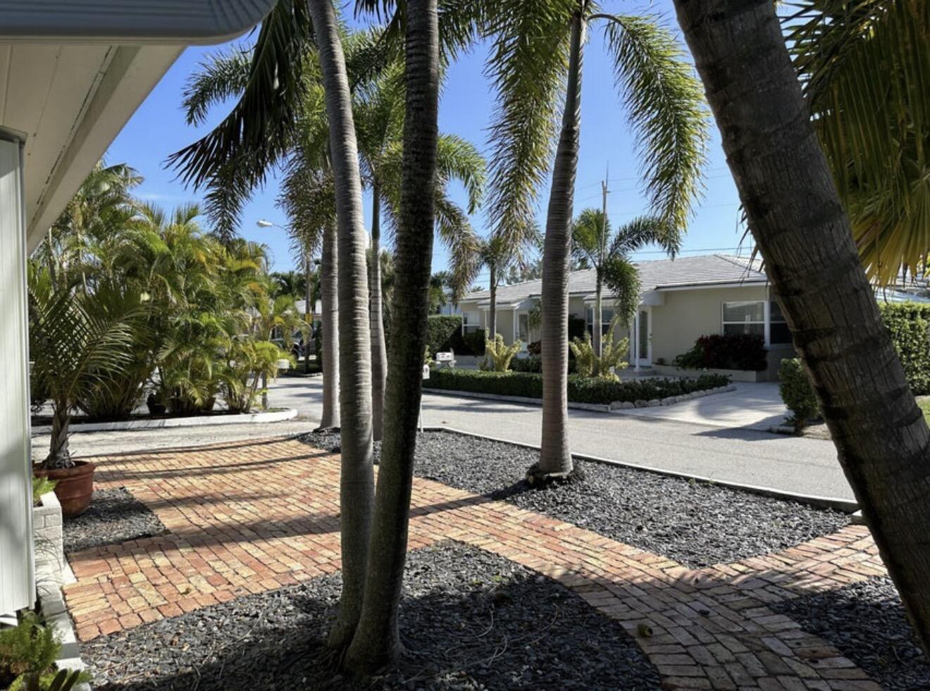 49 Douglas Drive Ocean Ridge, FL 33435 - Photo 10 of 65 a view of a entrance door of the house