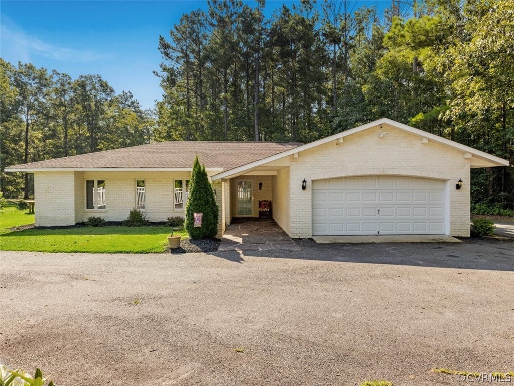 8231 Cattail Road Chesterfield, VA 23838 - Photo 1 of 38 a view of a house with a yard and garage