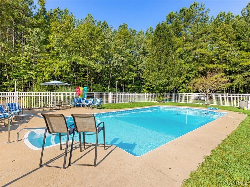 8231 Cattail Road Chesterfield, VA 23838 - Photo 33 of 38 a view of a swimming pool with a lounge chair
