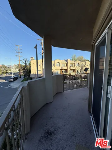 a bathroom with a granite countertop sink a mirror and a shower