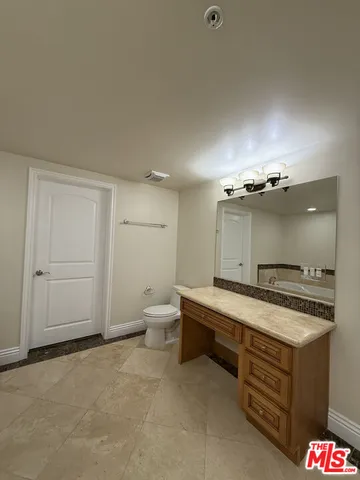 a bath tub sitting next to a small bathroom