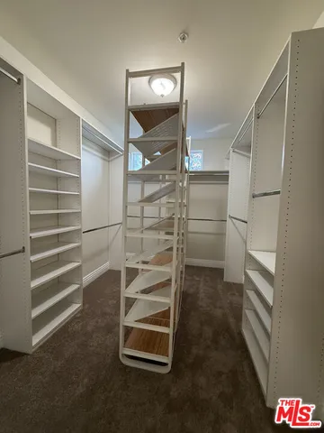 a large bathroom with a sink and a toilet