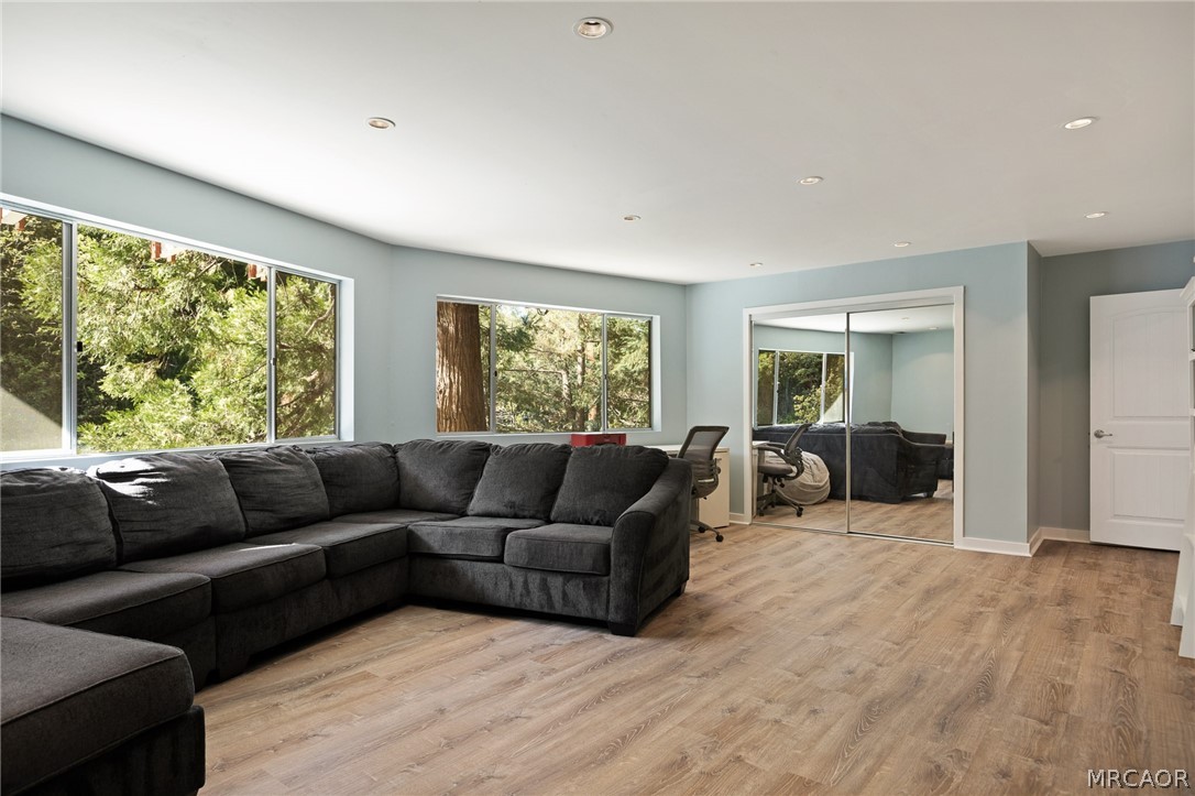 316 Pioneer Road Lake Arrowhead, CA 92352 - Photo 25 of 35 a living room with furniture and a large window