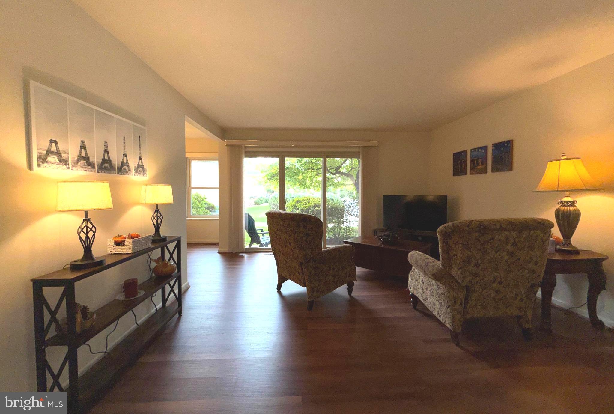 3352 Chiswick Court, Unit 572E Silver Spring, MD 20906 - Photo 13 of 41 a living room with furniture and a large window