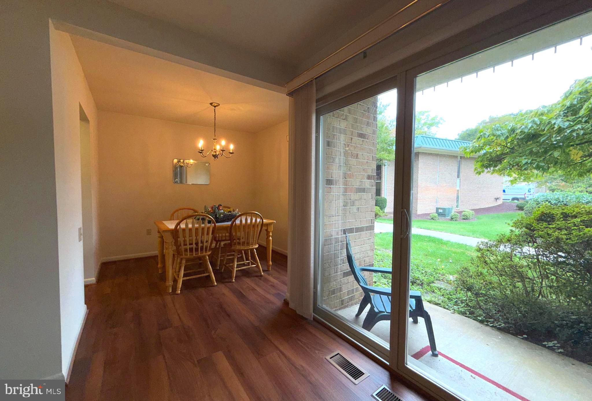 3352 Chiswick Court, Unit 572E Silver Spring, MD 20906 - Photo 16 of 41 a view of a porch with chairs and backyard