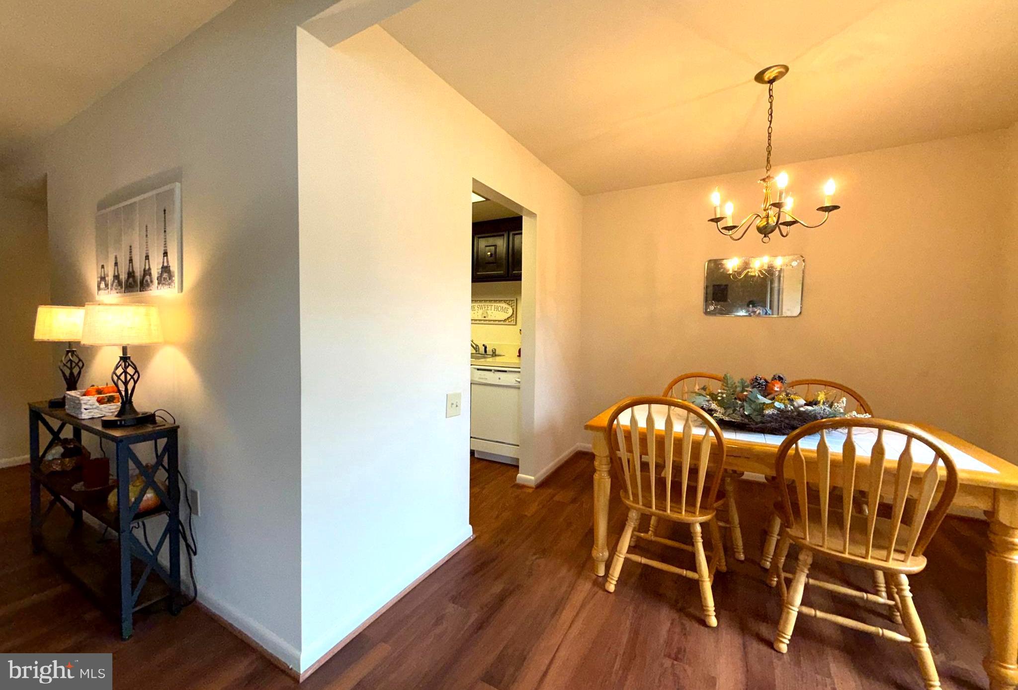 3352 Chiswick Court, Unit 572E Silver Spring, MD 20906 - Photo 17 of 41 a view of a dining room with furniture and wooden floor