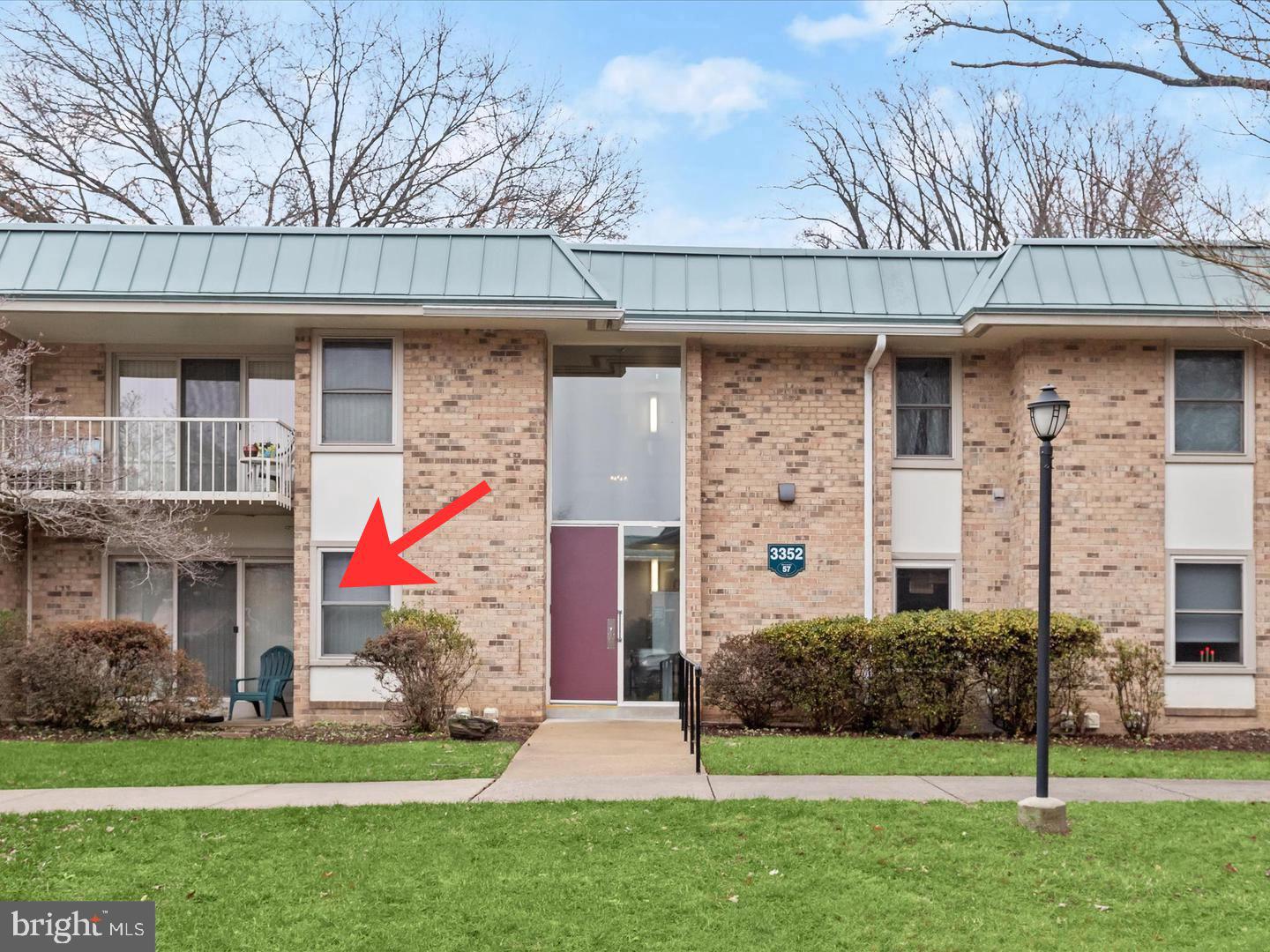 3352 Chiswick Court, Unit 572E Silver Spring, MD 20906 - Photo 2 of 41 a front view of a house with a yard