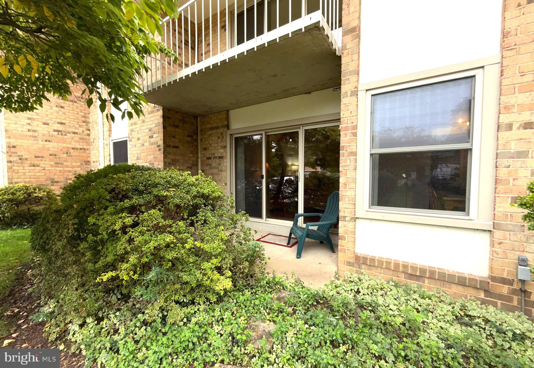 3352 Chiswick Court, Unit 572E Silver Spring, MD 20906 - Photo 27 of 41 front view of a house with a yard