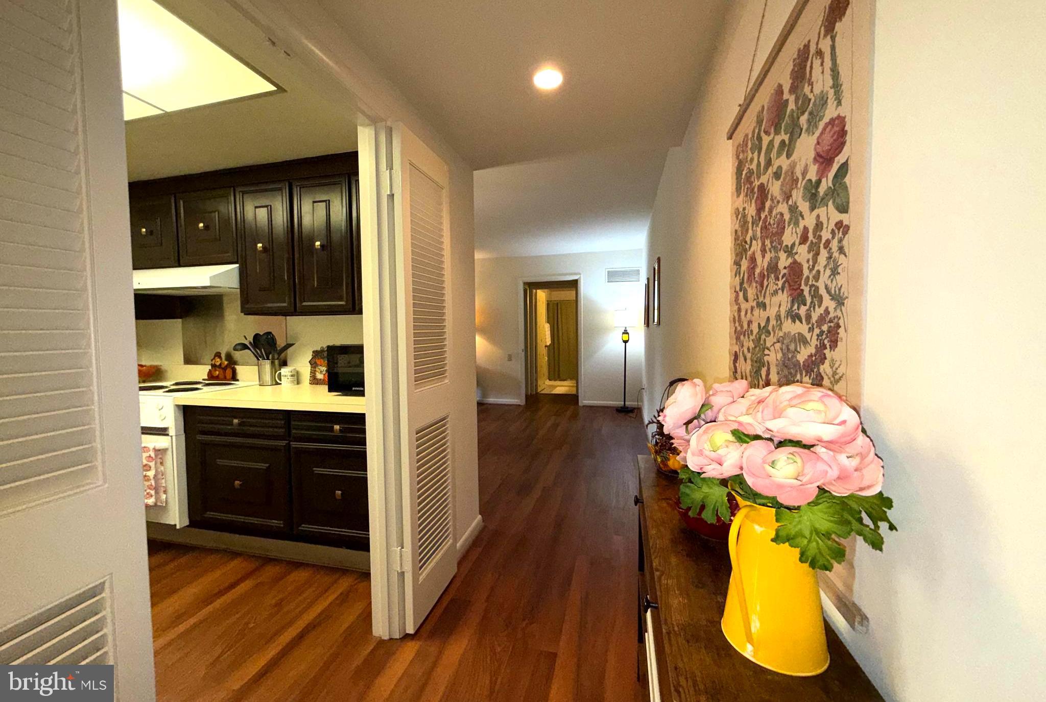 3352 Chiswick Court, Unit 572E Silver Spring, MD 20906 - Photo 5 of 41 a bathroom with a sink mirror and vanity
