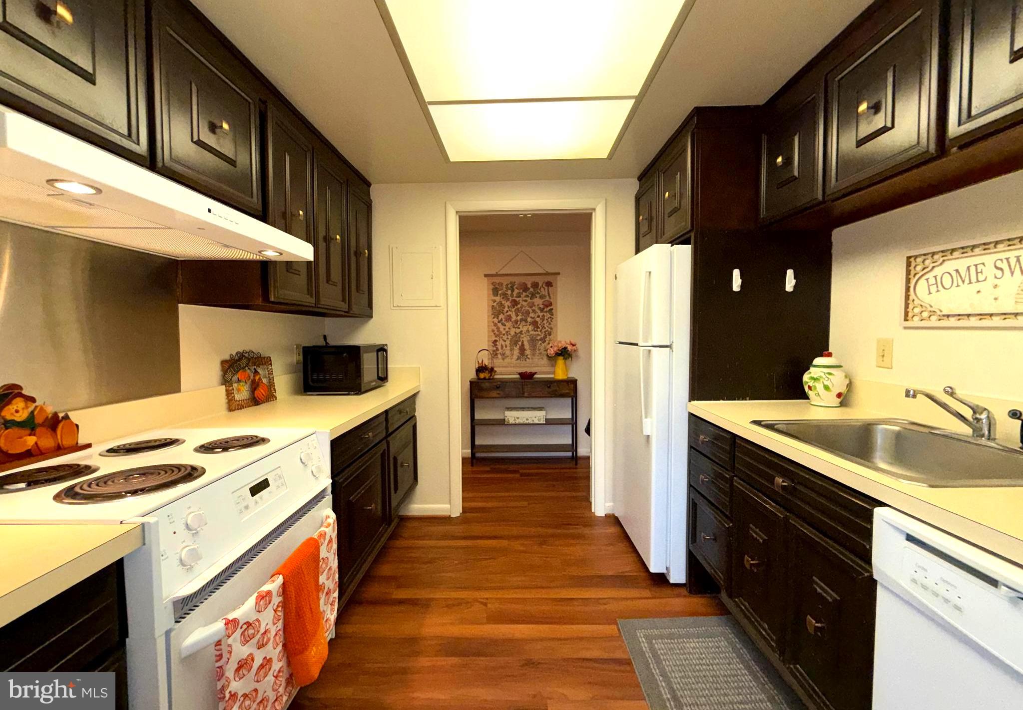 3352 Chiswick Court, Unit 572E Silver Spring, MD 20906 - Photo 8 of 41 a kitchen with stainless steel appliances granite countertop a sink and cabinets