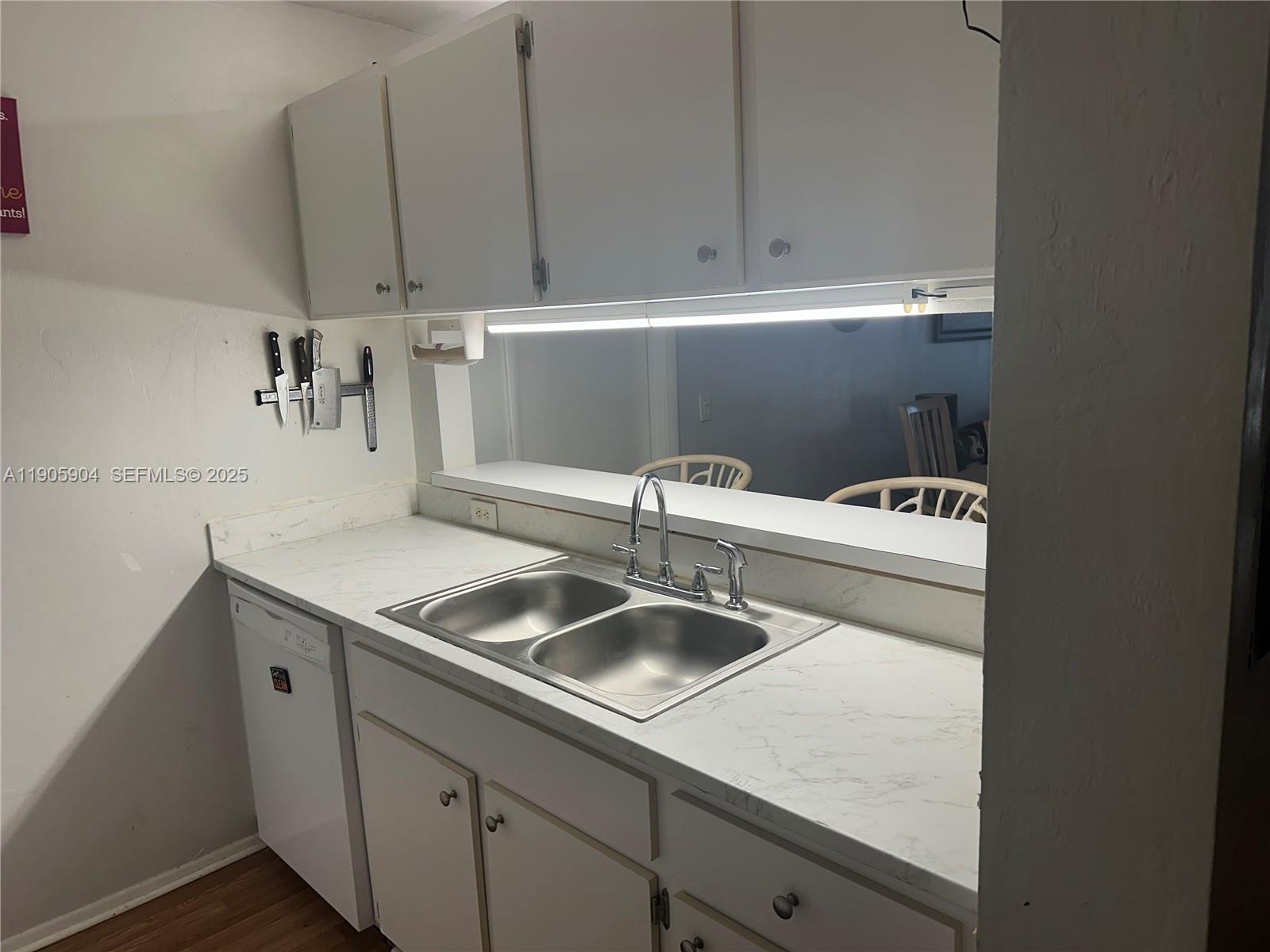 4000 Southwest 23rd Street, Unit 2301 Gainesville, FL 32608 - Photo 4 of 19 a kitchen with a sink and cabinets