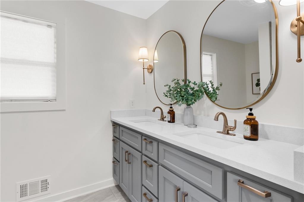 295 Starcross Lane Jasper, GA 30143 - Photo 29 of 65 a bathroom with a sink and a mirror