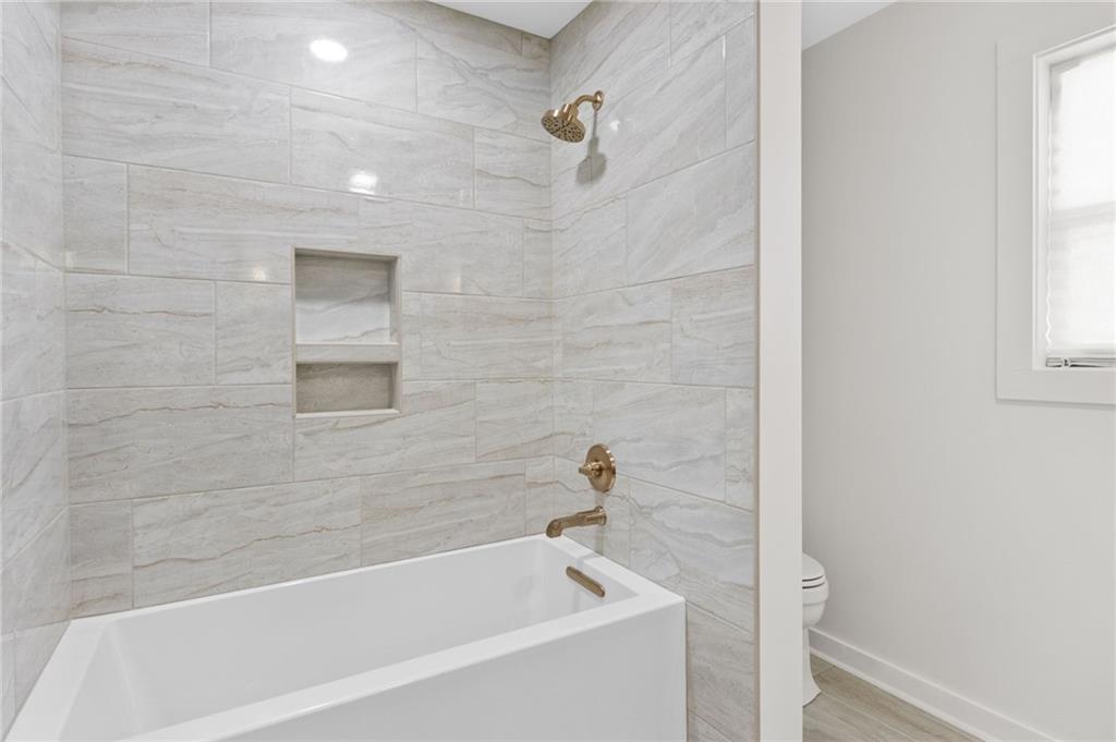 295 Starcross Lane Jasper, GA 30143 - Photo 30 of 65 a bathroom with a bathtub