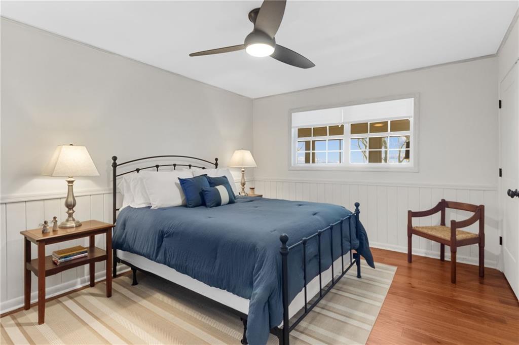 295 Starcross Lane Jasper, GA 30143 - Photo 31 of 65 a bedroom with a bed and a night stand
