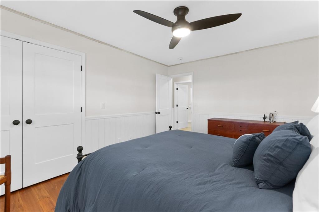 295 Starcross Lane Jasper, GA 30143 - Photo 32 of 65 a bedroom with a bed and a ceiling fan