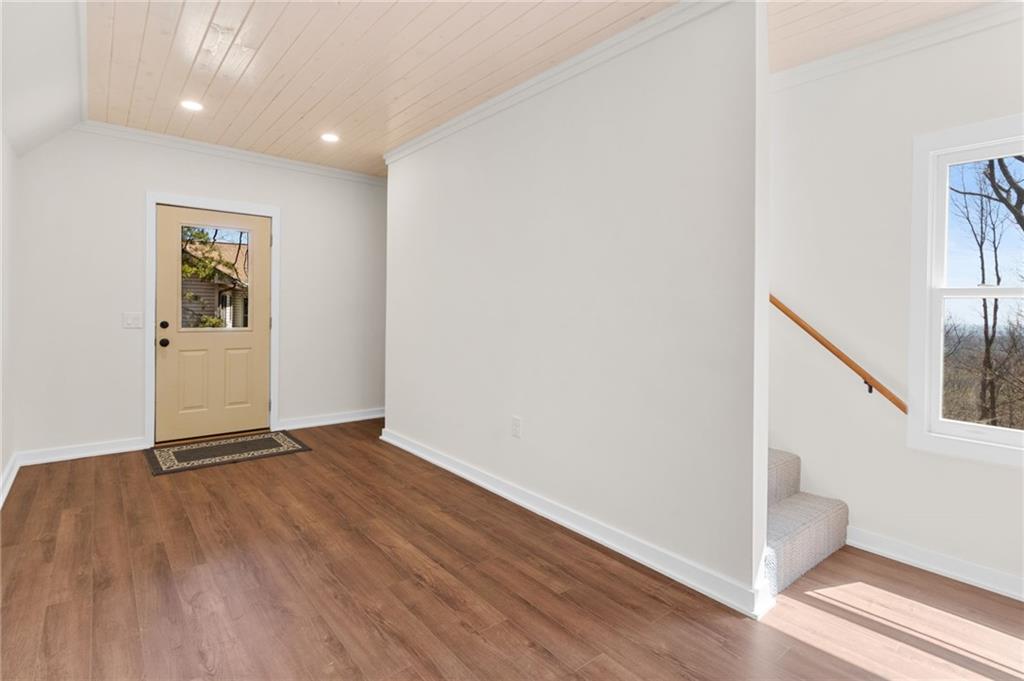 295 Starcross Lane Jasper, GA 30143 - Photo 35 of 65 a view of an empty room with wooden floor