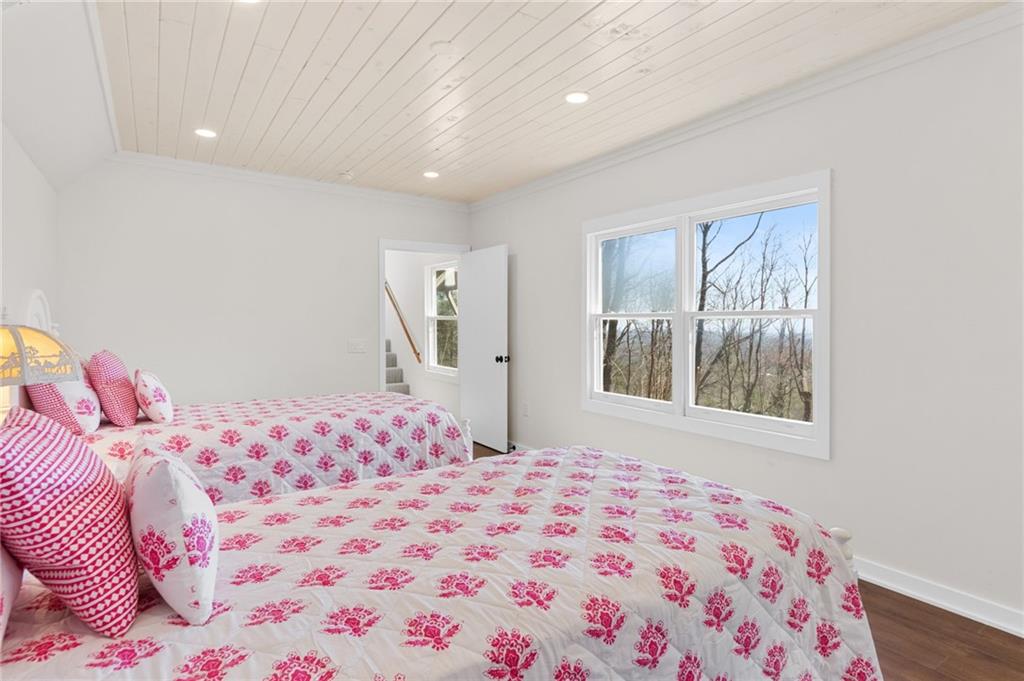 295 Starcross Lane Jasper, GA 30143 - Photo 37 of 65 a bedroom with a bed and a window