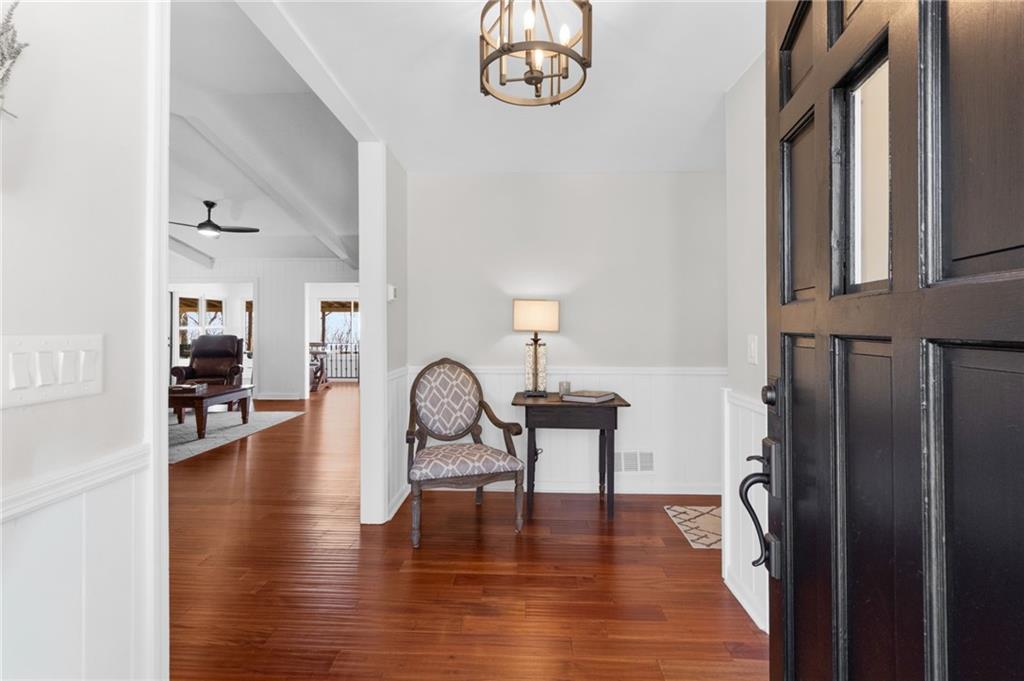 295 Starcross Lane Jasper, GA 30143 - Photo 5 of 65 a view of a livingroom with furniture wooden floor windows and entryway