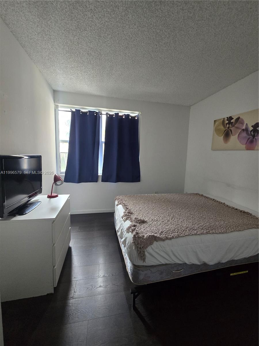 17150 North Bay Road, Unit 2316 Sunny Isles Beach, FL 33160 - Photo 6 of 9 a bedroom with a bed and a couch