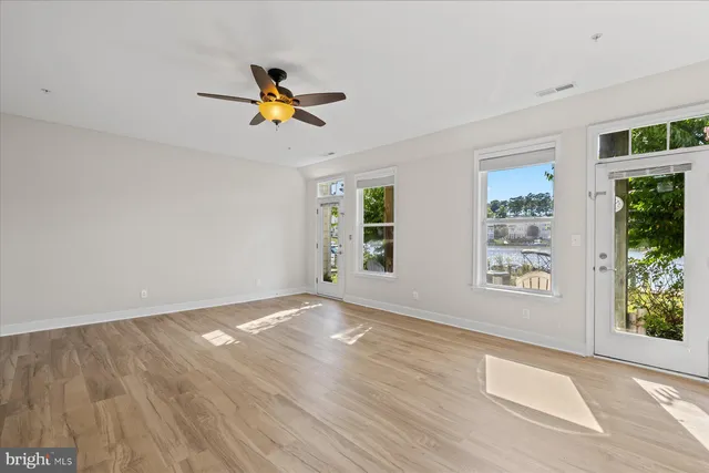 a view of a lake with houses in the back