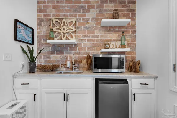 a sink with a stove and a microwave