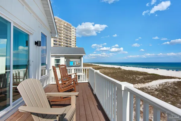 a view of a balcony with furniture
