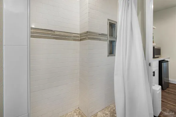 a bathroom with a glass door shower