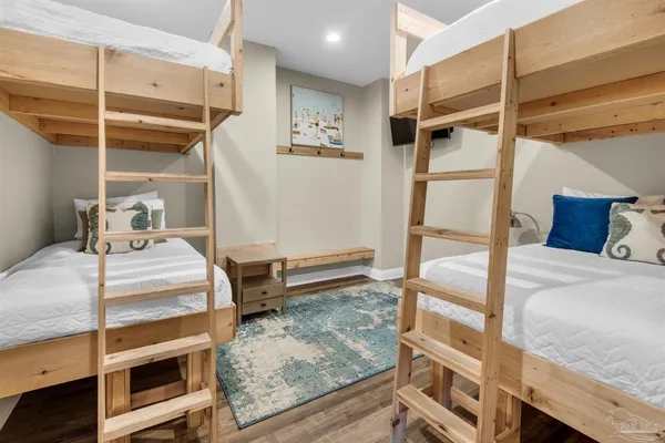 a bedroom with a bed and a mirror