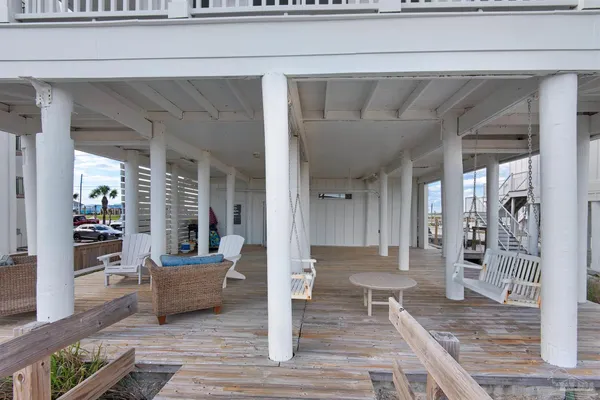 a living room with furniture and a entrance