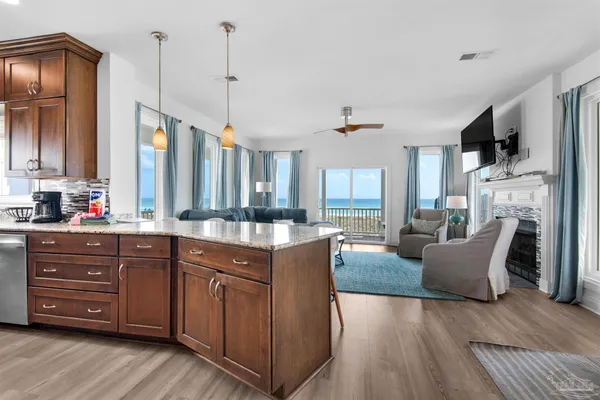 a view of a room with a table and chairs