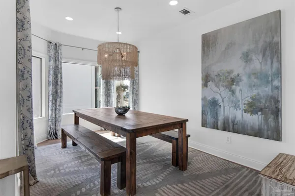 a view of a dining room with furniture