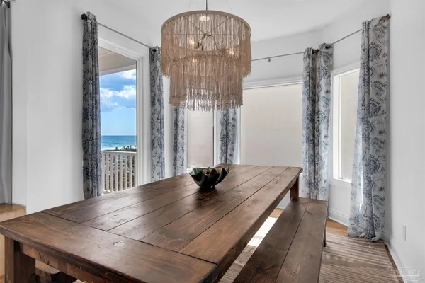 a kitchen with stainless steel appliances granite countertop a sink a stove and a wooden floors