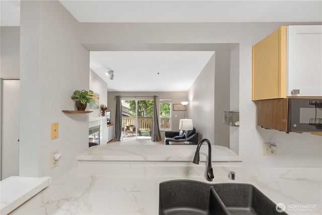 a kitchen with a sink and a refrigerator