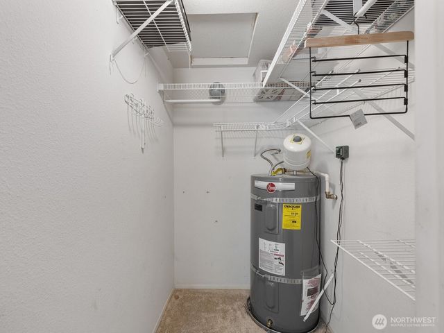 a view of storage and utility room with racks on the wall