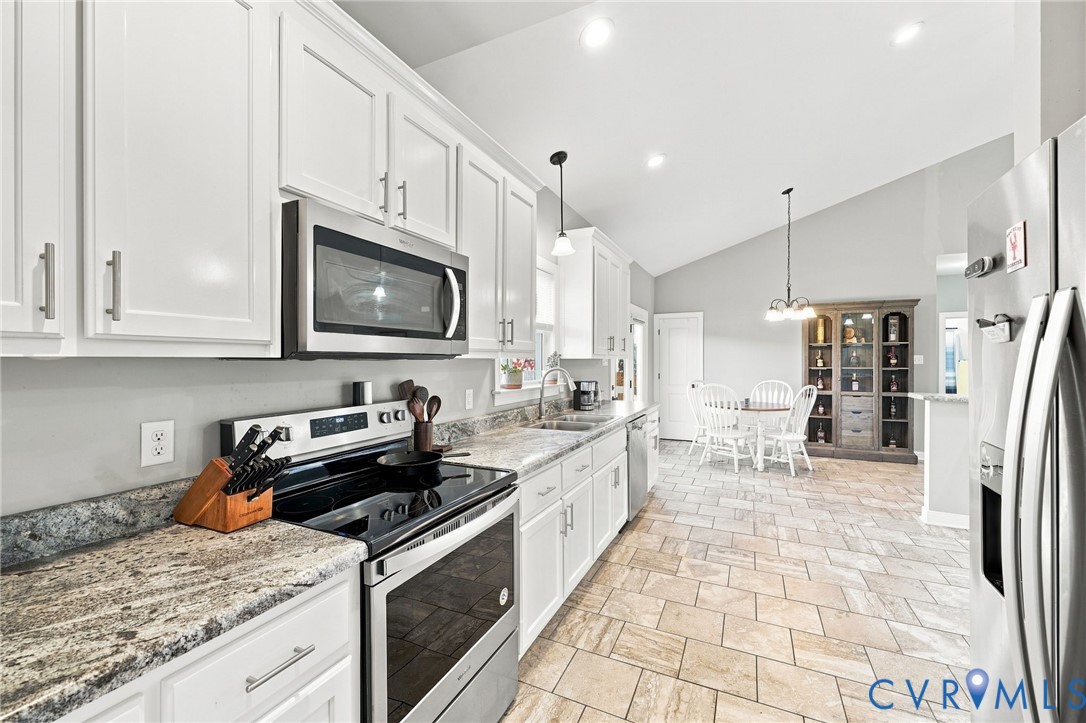 8718 Rock Cedar Road New Kent, VA 23124 - Photo 19 of 43 Kitchen featuring white cabinetry, stainless steel
