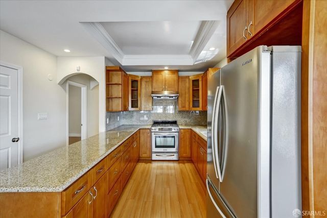 a view of a kitchen with a large window