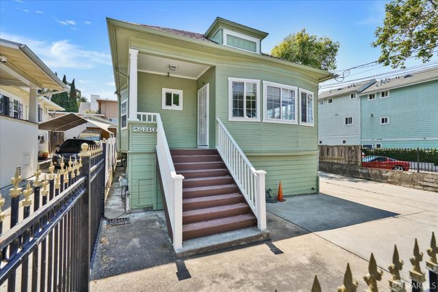 a view of a house with wooden stairs
