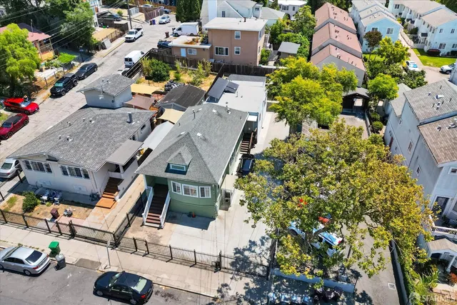 an aerial view of a houses with yard
