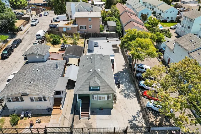 an aerial view of multiple houses with outdoor space